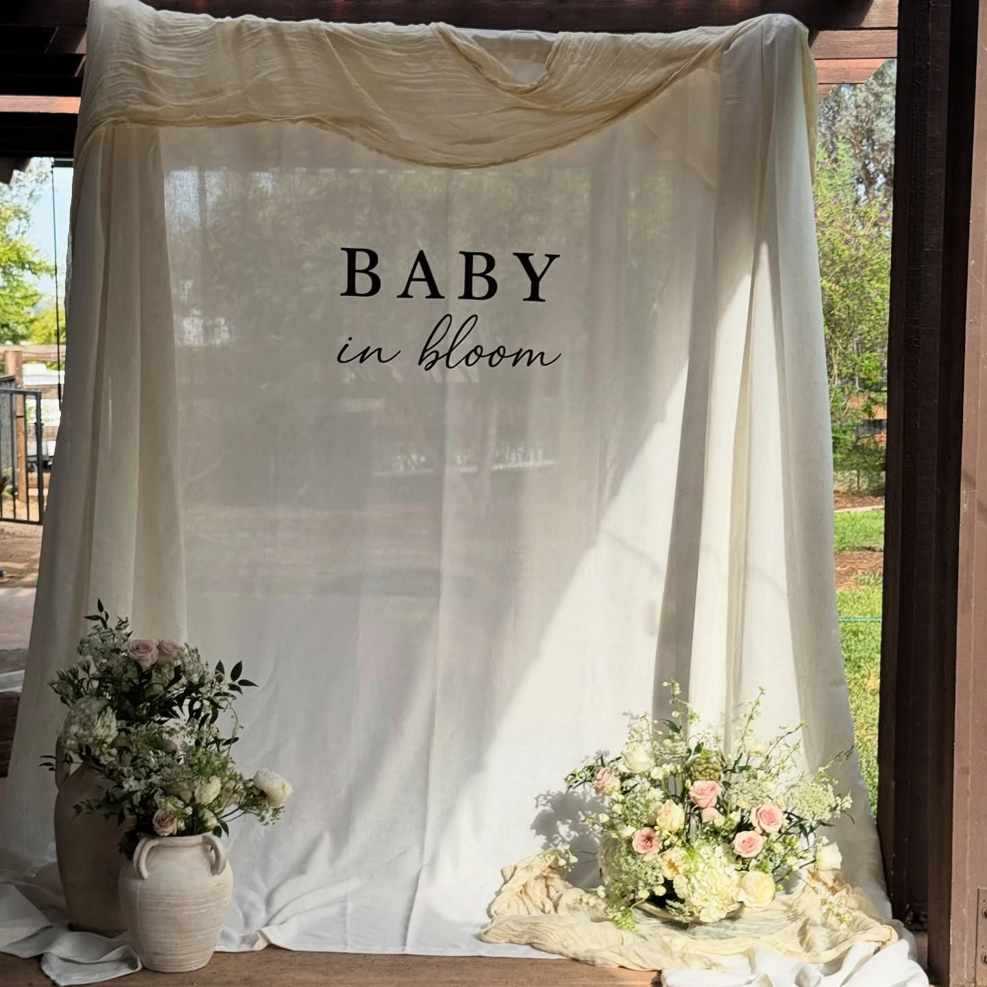 24. Minimalist Draped Fabric Backdrop