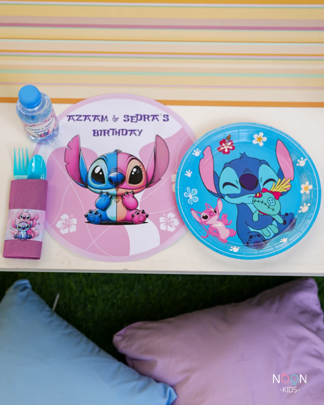 A custom Stitch and Angel themed party place setting with a personalized plate and placemat.