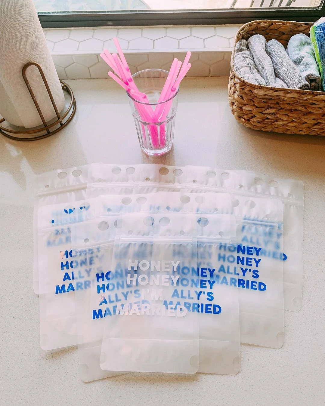 Custom Mamma Mia themed bachelorette party drink pouches that say 'Honey Honey I'm Married'.