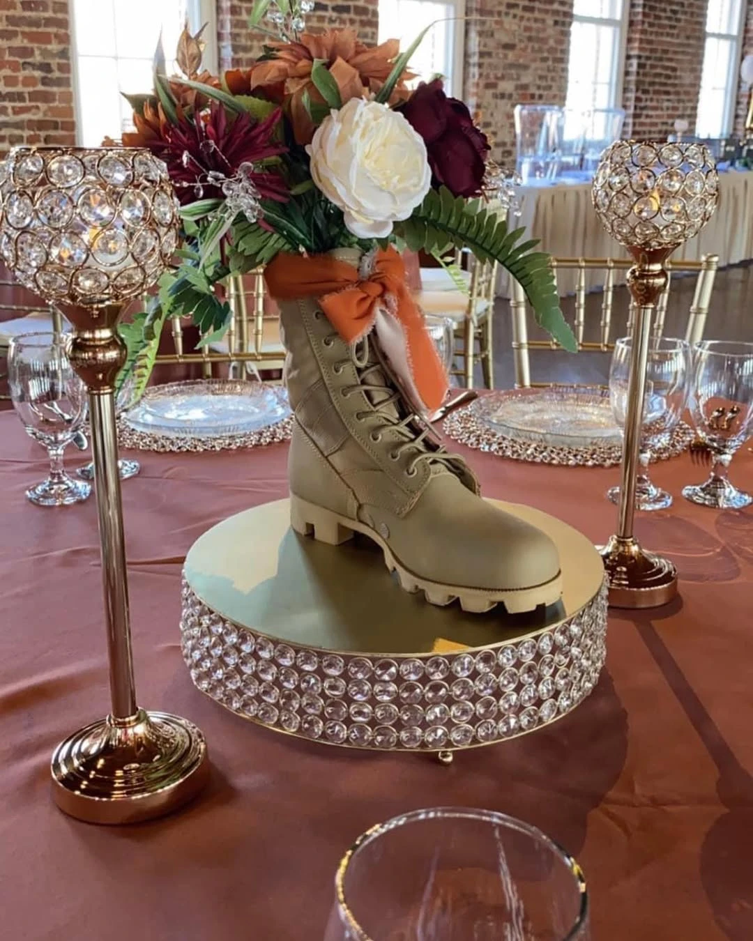 Tribute table at a military retirement party with a uniform, awards, and photos.