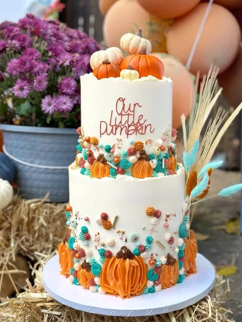 Colorful Piped Pumpkin Cake fall themed baby shower ideas
