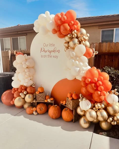 Pumpkin Harvest Photo Zone fall themed baby shower ideas
