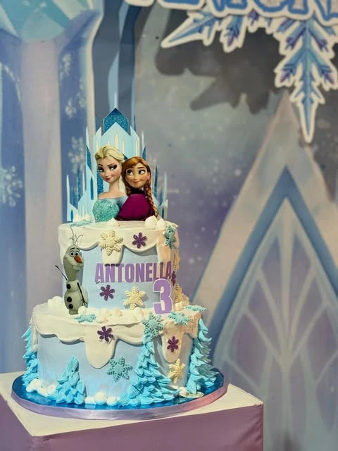 Multi-Tiered Snowy Character Cake frozen birthday party ideas