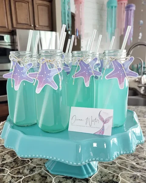 Refreshing Seafoam Punch Bottles mermaid birthday party ideas