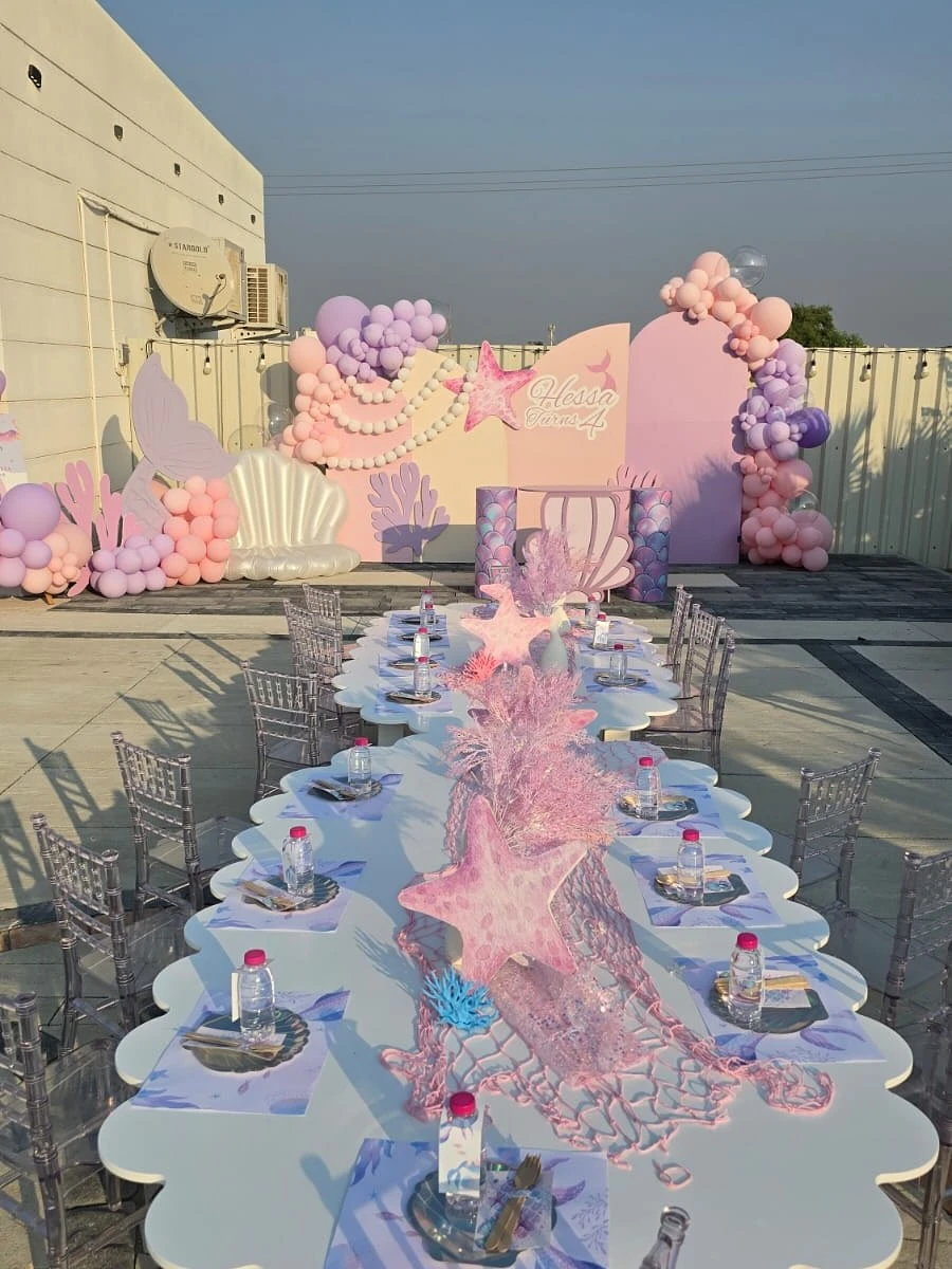 Wave-Inspired Scalloped Tables mermaid birthday party ideas