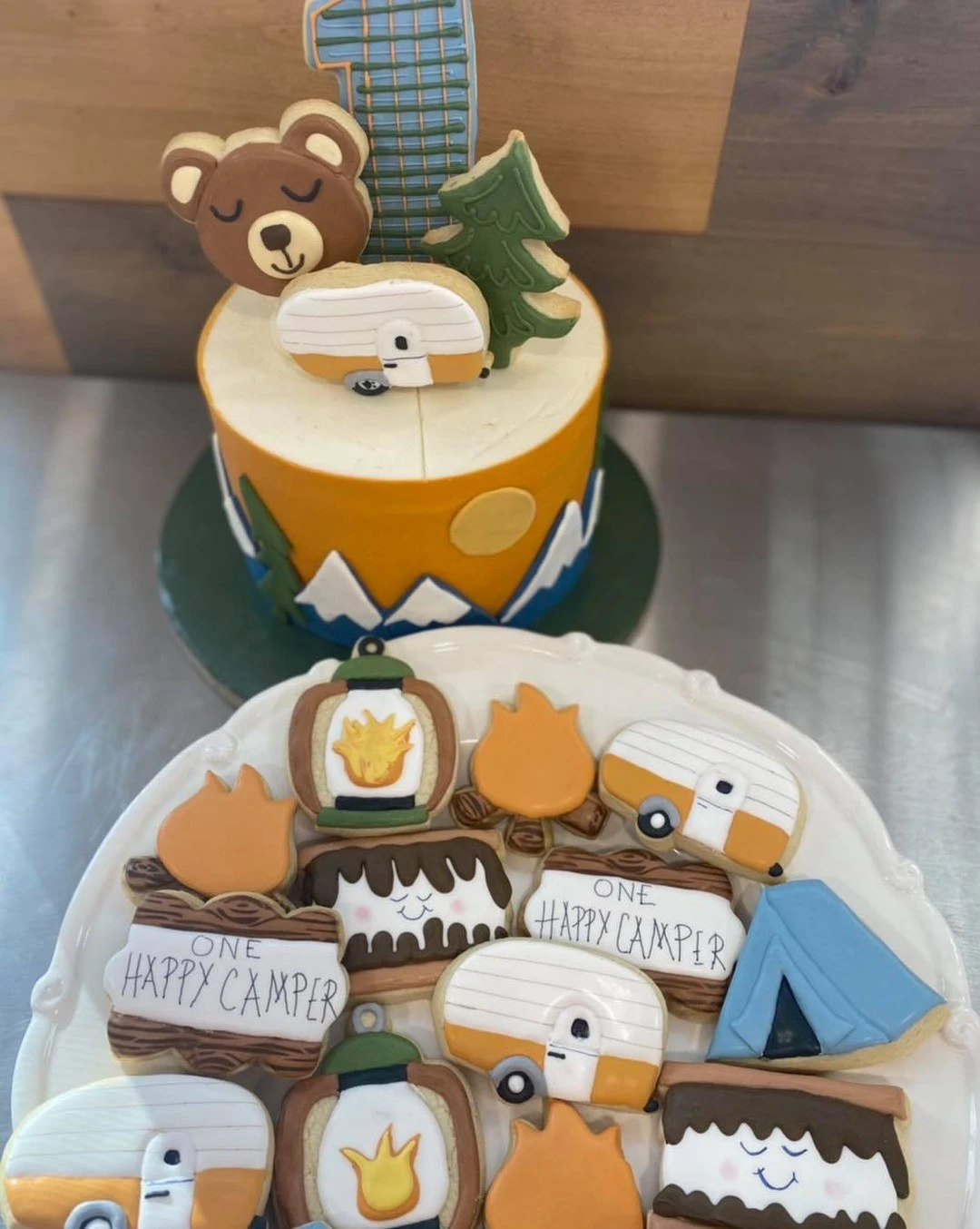 Cookie-Topped Adventure Cake one happy camper first birthday