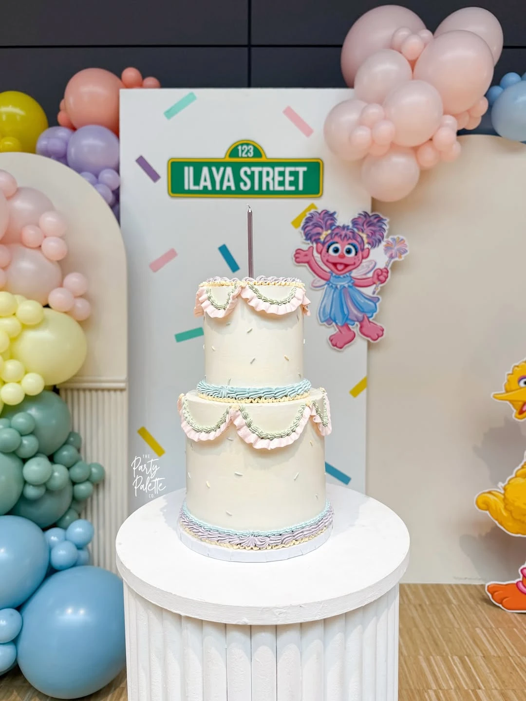 Pastel Character Cake Display sesame street birthday party ideas