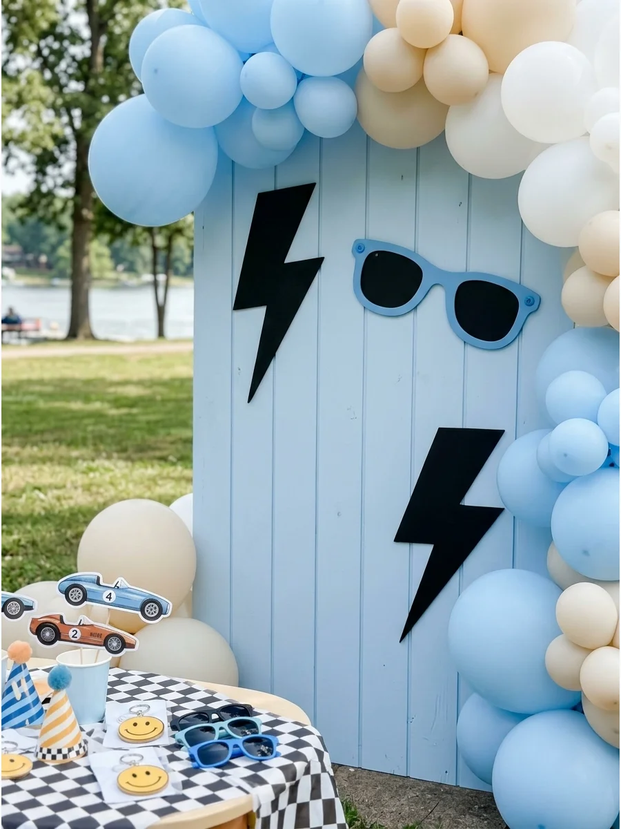 Cool dude birthday theme with sunglasses and blue balloon decor.