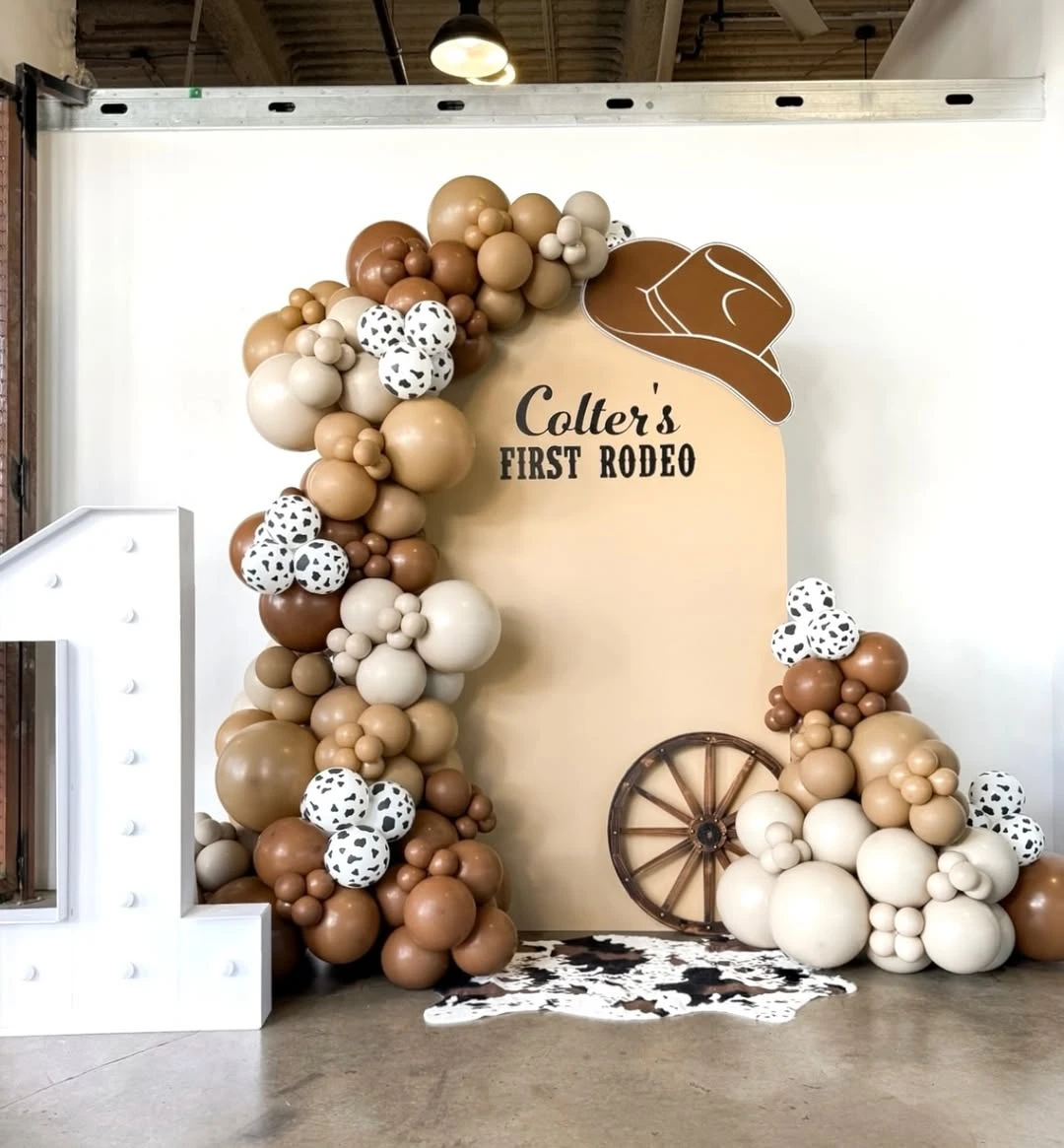 Earthy Arched Backdrop first rodeo birthday party