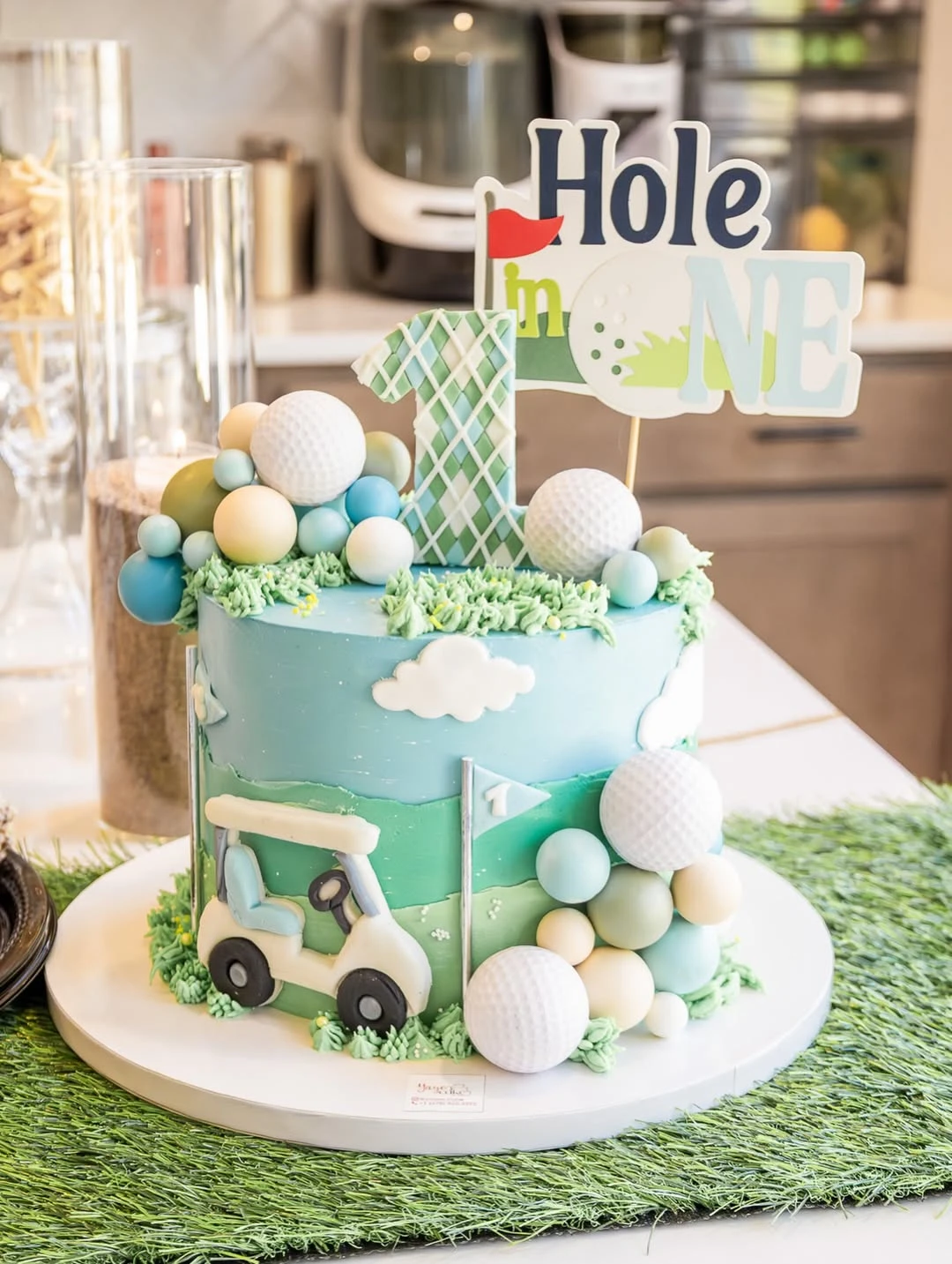 Sculpted Greenery Cake hole in one first birthday