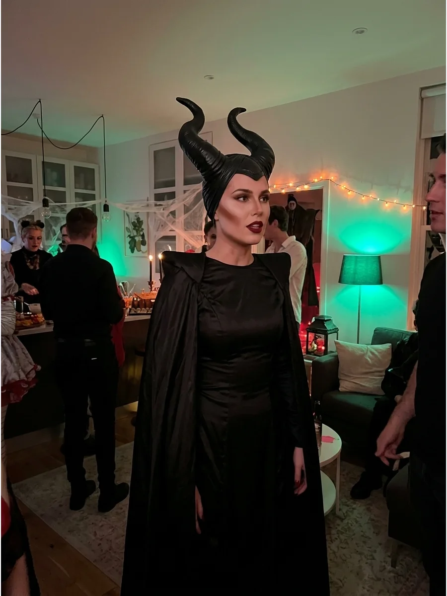 Maleficent. Create Maleficent’s powerful silhouette with a long black gown, dramatic cape, sculpted horn headpiece, bold cheek contour, and dark red lipstick. Iconic halloween cost