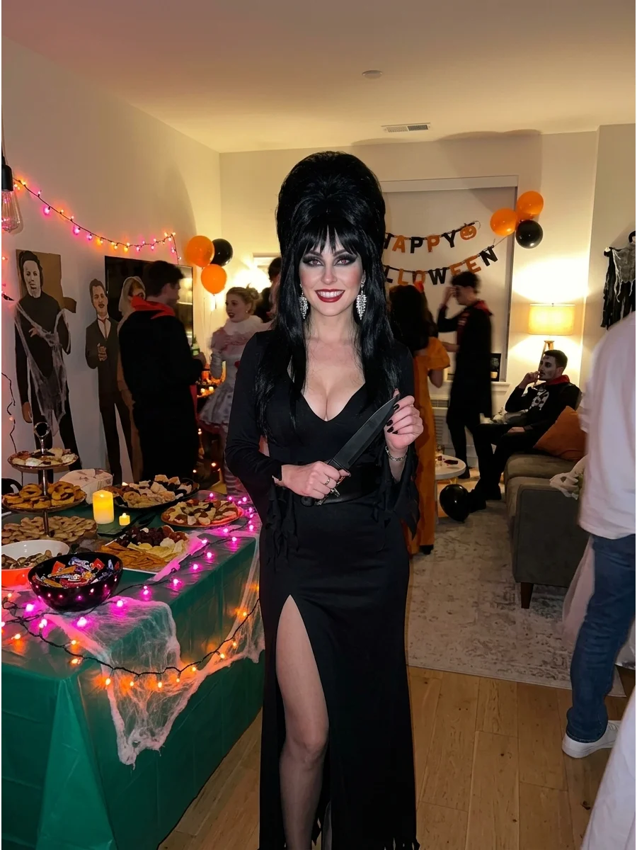 Elvira. Transform into the Mistress of the Dark with a long black gothic gown, dramatic black wig, smoky makeup, red lipstick, and sparkling earrings. Iconic halloween costumes wom