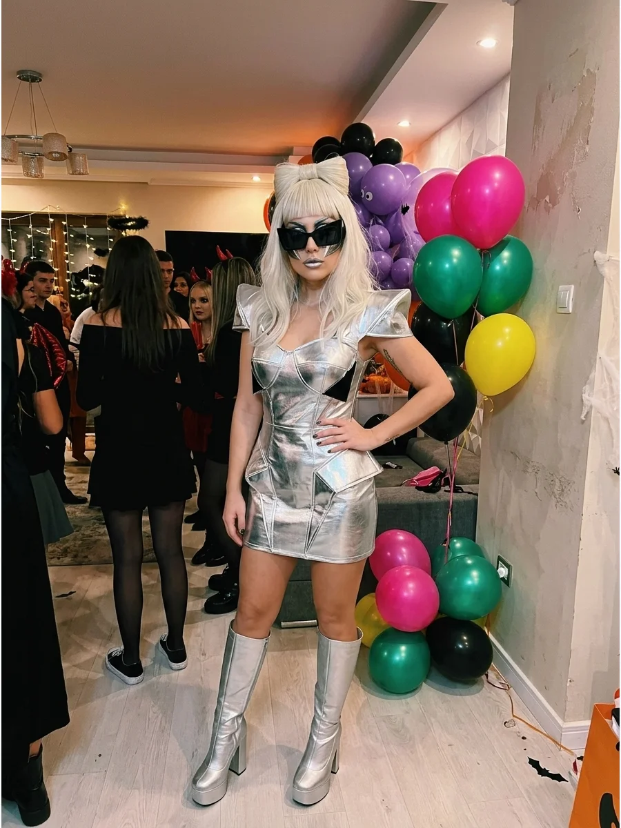 Lady Gaga. Create a classic Gaga look with a metallic mini dress, geometric sunglasses, platinum-blonde wig, tall boots, and bold futuristic makeup. Iconic halloween costumes women