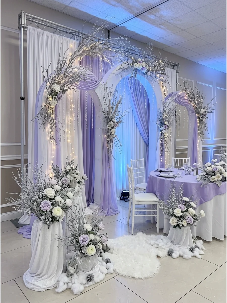 An elegant frosted fairytale baby shower backdrop with silver branches and crystals.