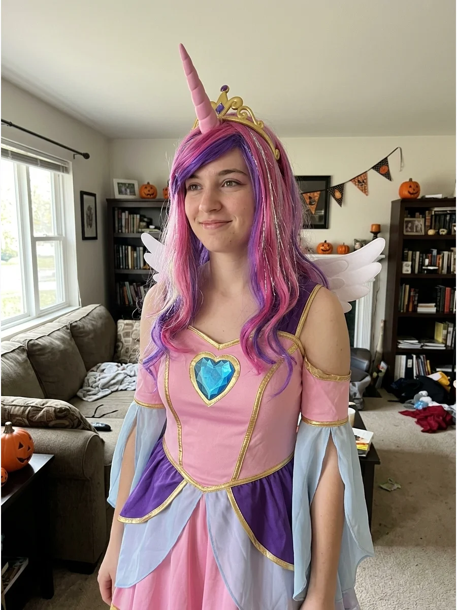 Princess Cadance Costume. Create a Princess Cadance outfit using a pink dress with gold, purple, and pale blue details. Add a pink-and-purple wig, wings, a unicorn horn, and a blue