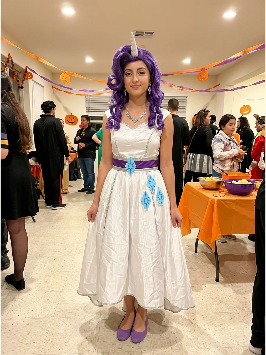 Rarity Costume. Create an elegant Rarity costume using a white dress with purple, silver, or blue accessories. Add a curled purple wig, unicorn horn, sparkling jewelry, and three b