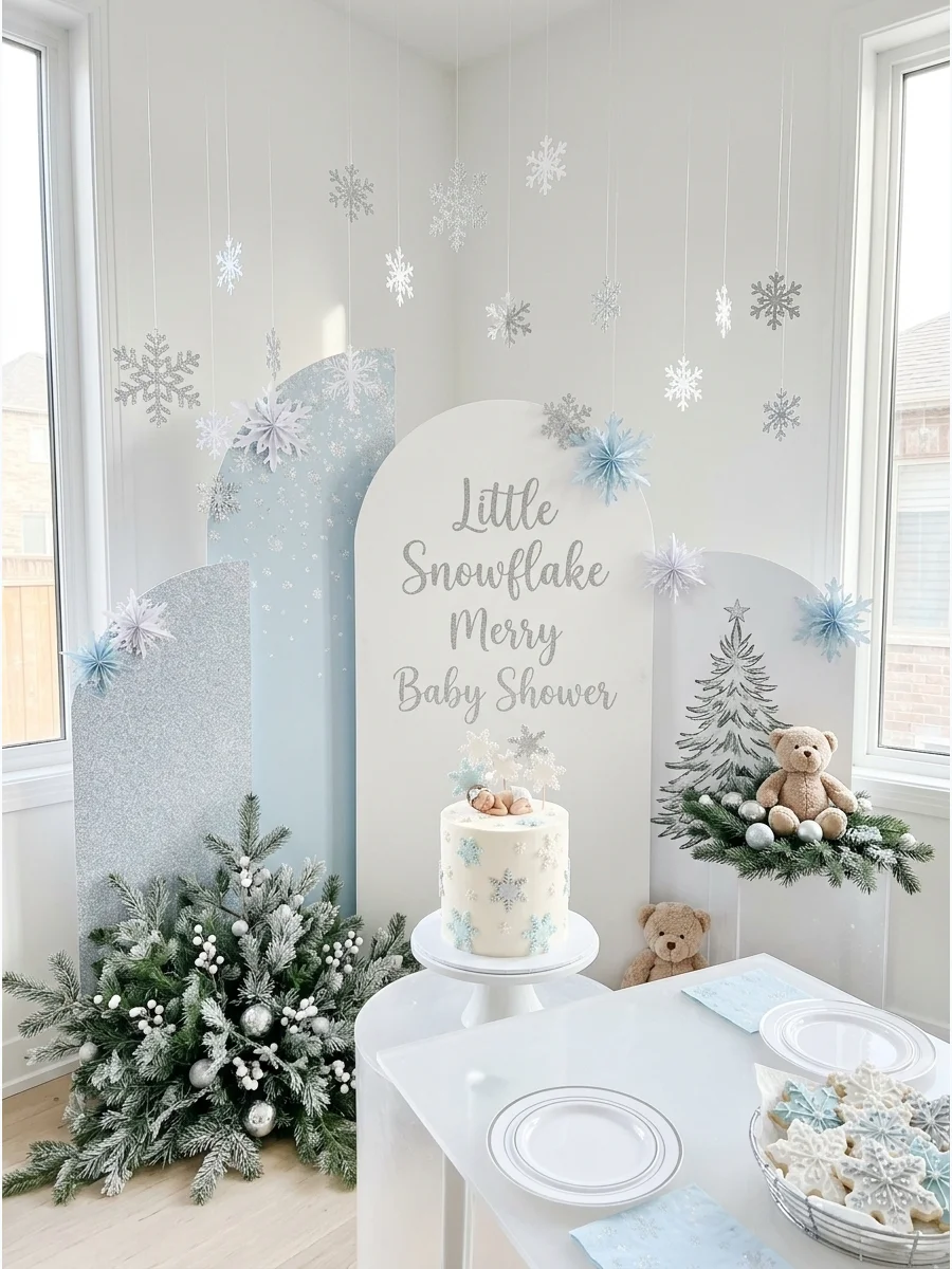 A white and silver snowflake-themed baby shower setup.