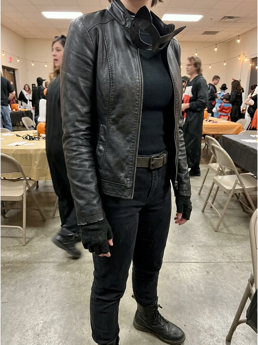 Thrifted Catwoman Costume. Search your closet or a secondhand store for black pants, a fitted jacket, gloves, and boots. Using pieces with slightly different textures can make the