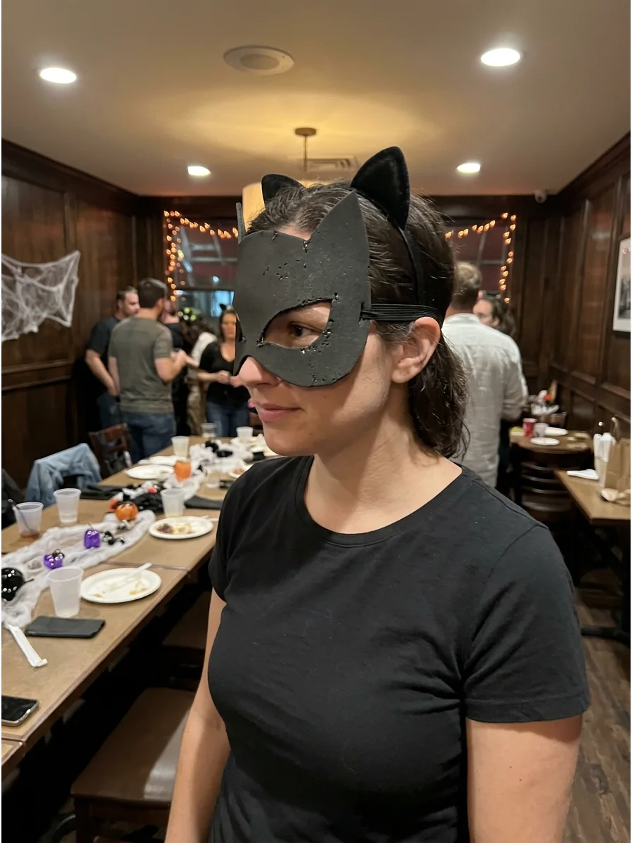 DIY Catwoman Mask Costume. Cut a simple eye mask from black felt or flexible craft foam and attach elastic to each side. Wear it with an all-black outfit and cat ears for a low-cos