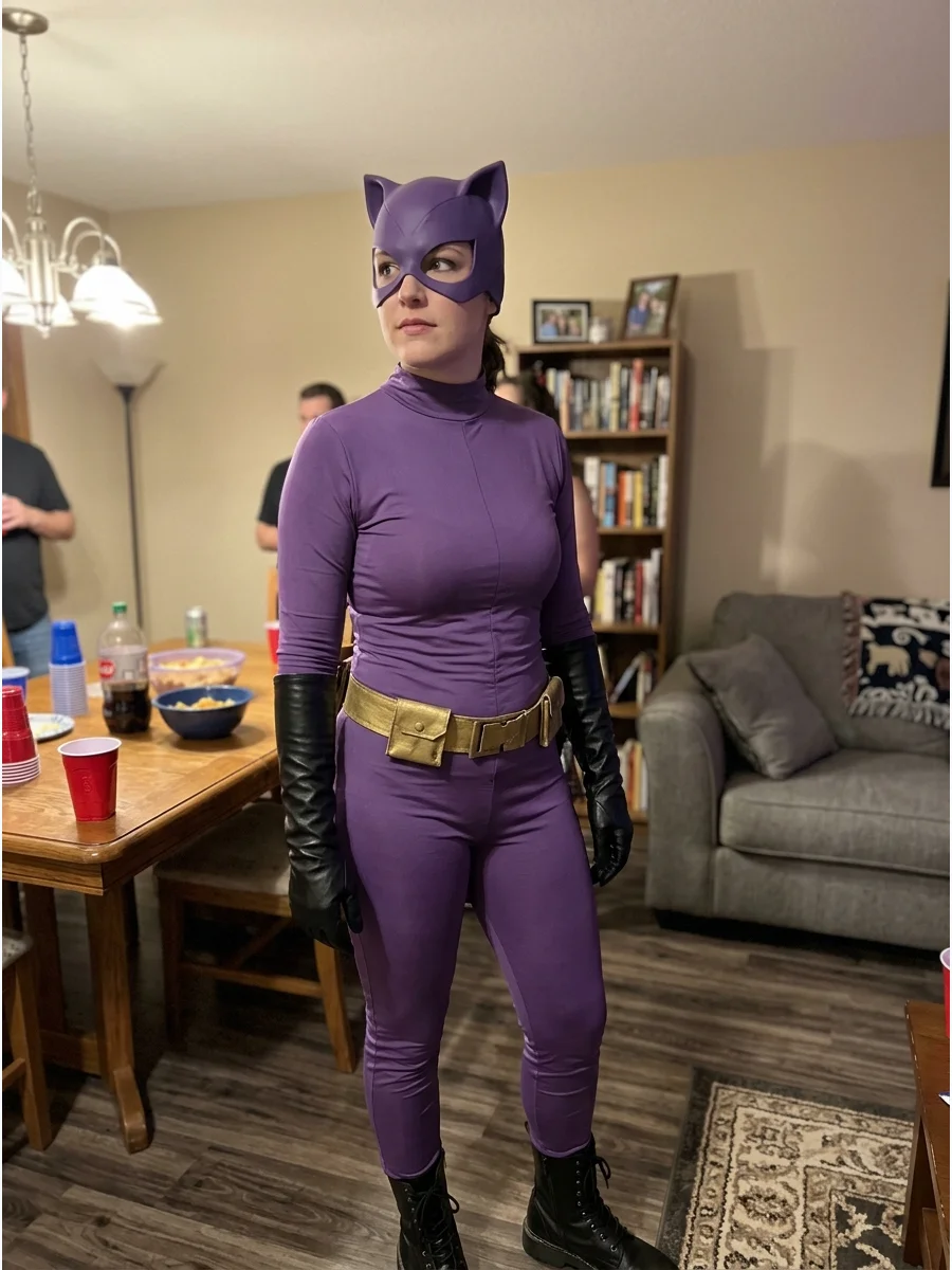 Purple Comic-Inspired Catwoman Costume. Replace the traditional black outfit with a purple jumpsuit or matching purple top and leggings. Complete the comic-inspired look with black