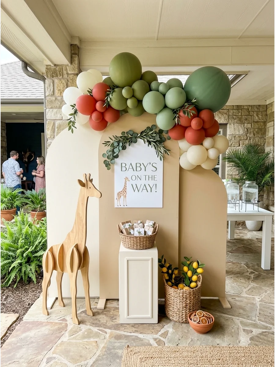 A three-panel arched photo backdrop in cream and tan on a stone patio.