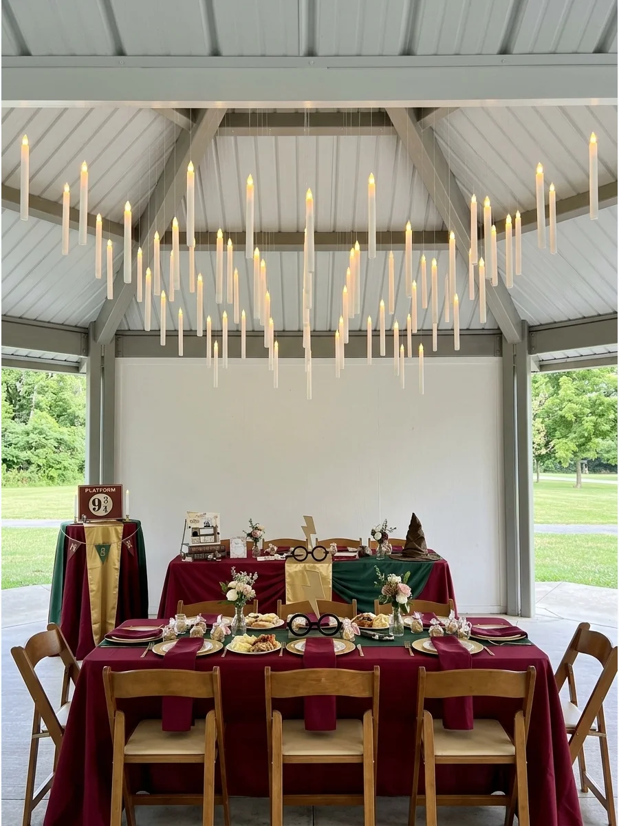 White LED taper candles hanging from a ceiling with invisible thread.