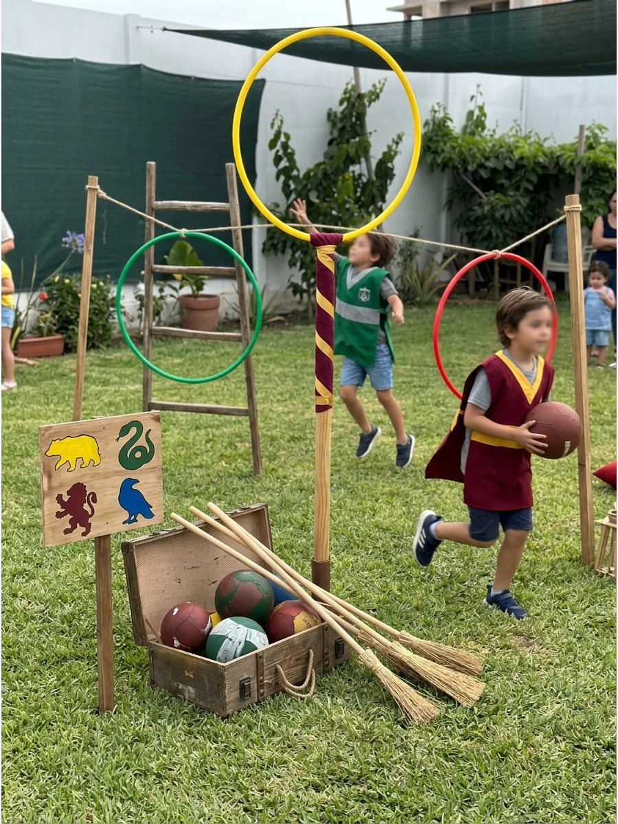 Backyard Quidditch Game. Create a simplified Quidditch-inspired obstacle game using hoops, balls, brooms, and teams divided by Hogwarts house. Harry Potter Birthday Party Ideas