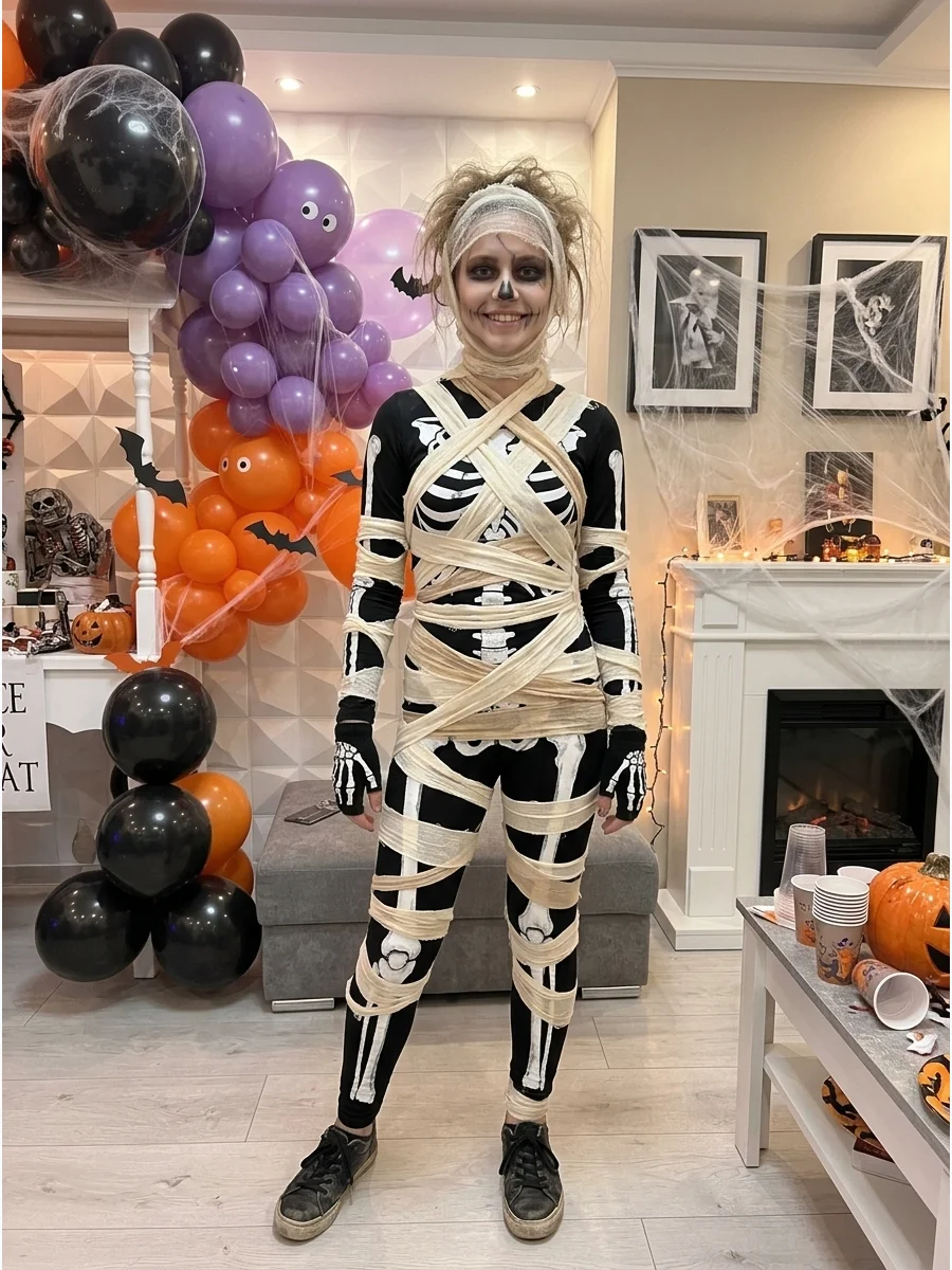 Skeleton Mummy Costume. Wear a skeleton-print shirt or leggings underneath loosely spaced mummy strips. The bones visible through the gaps give the costume a creative two-in-one ap