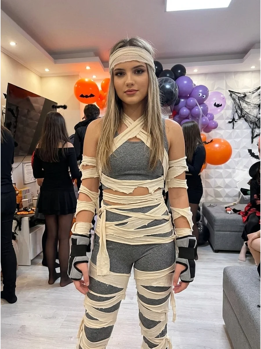Mummy Ninja Costume. Wear a white or gray athletic outfit with carefully secured strips and a fabric headband. Add soft costume wrist guards to combine mummy textures with an actio