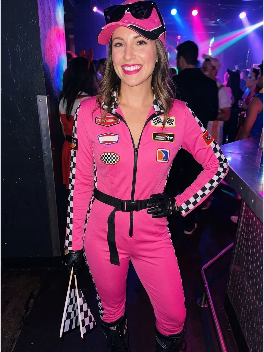 A woman in a hot pink racing suit with checkered accessories.