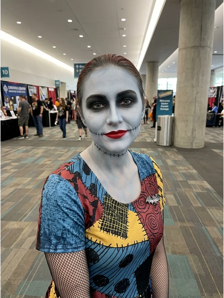 Sally makeup featuring dark smoky eyes and a pale blue complexion.