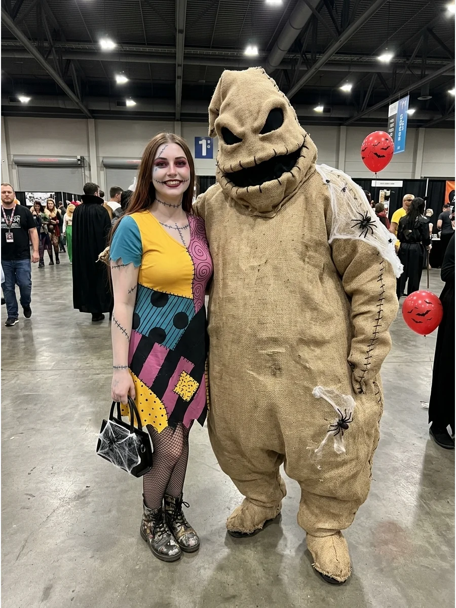Cosplayers dressed as Sally and Oogie Boogie in a convention hall.