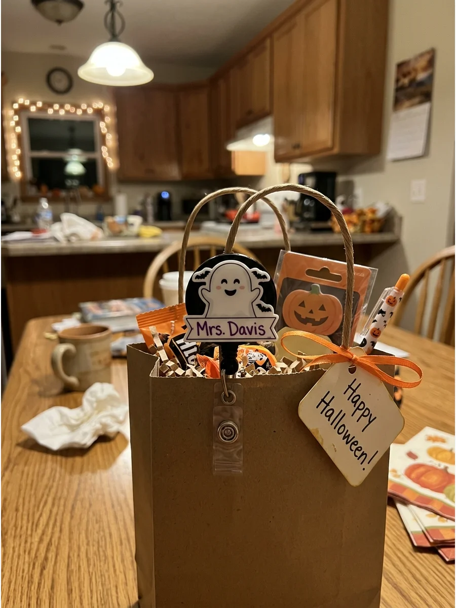 Personalized Badge Reel. Select a retractable badge reel with a friendly ghost, pumpkin, apple, or pencil design. Add the teacher’s name or initials for an extra personal detail. T