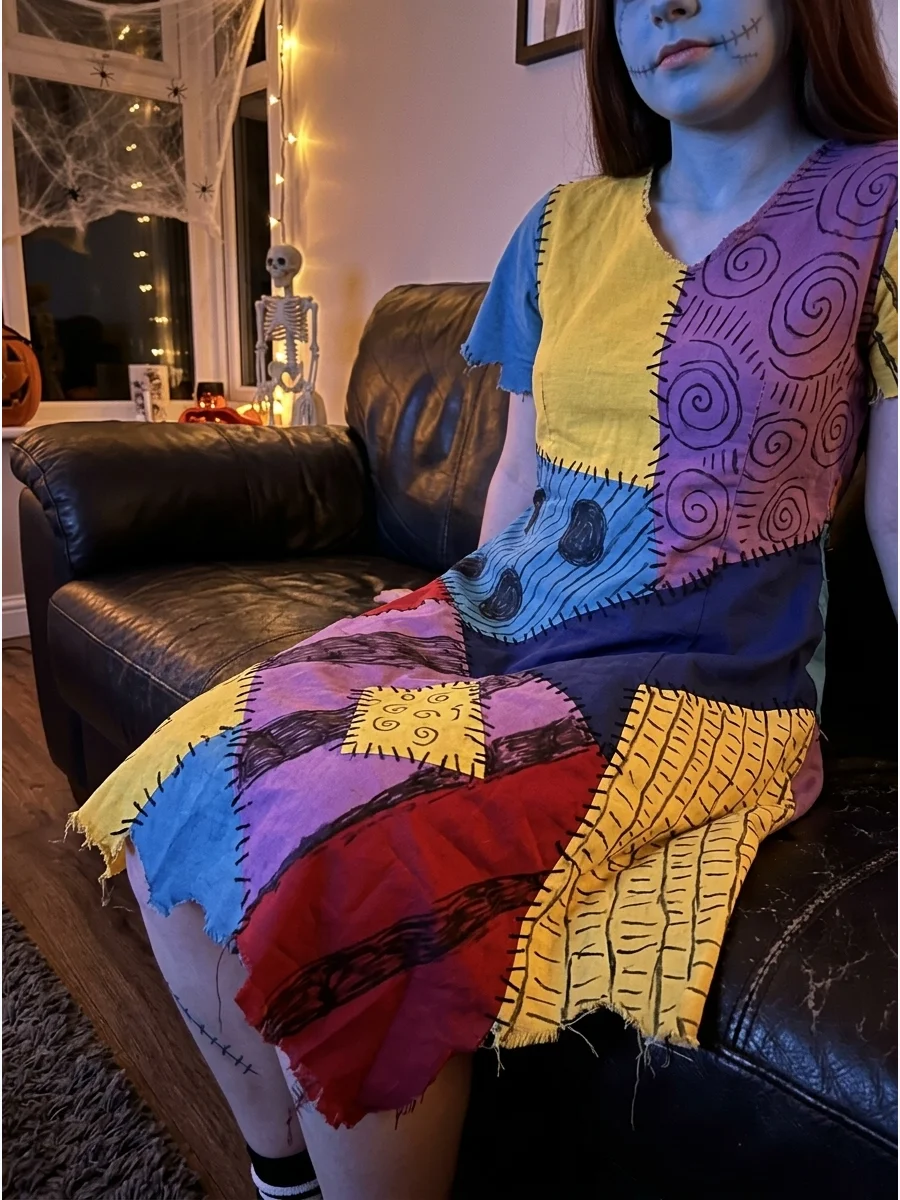 A DIY Sally costume made from thrifted fabrics with hand-drawn patterns.