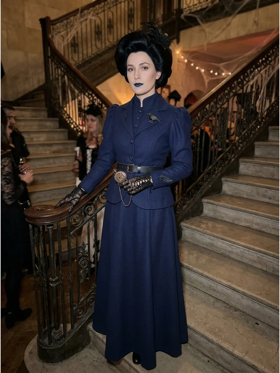 A woman in a Miss Peregrine navy suit costume on a staircase.