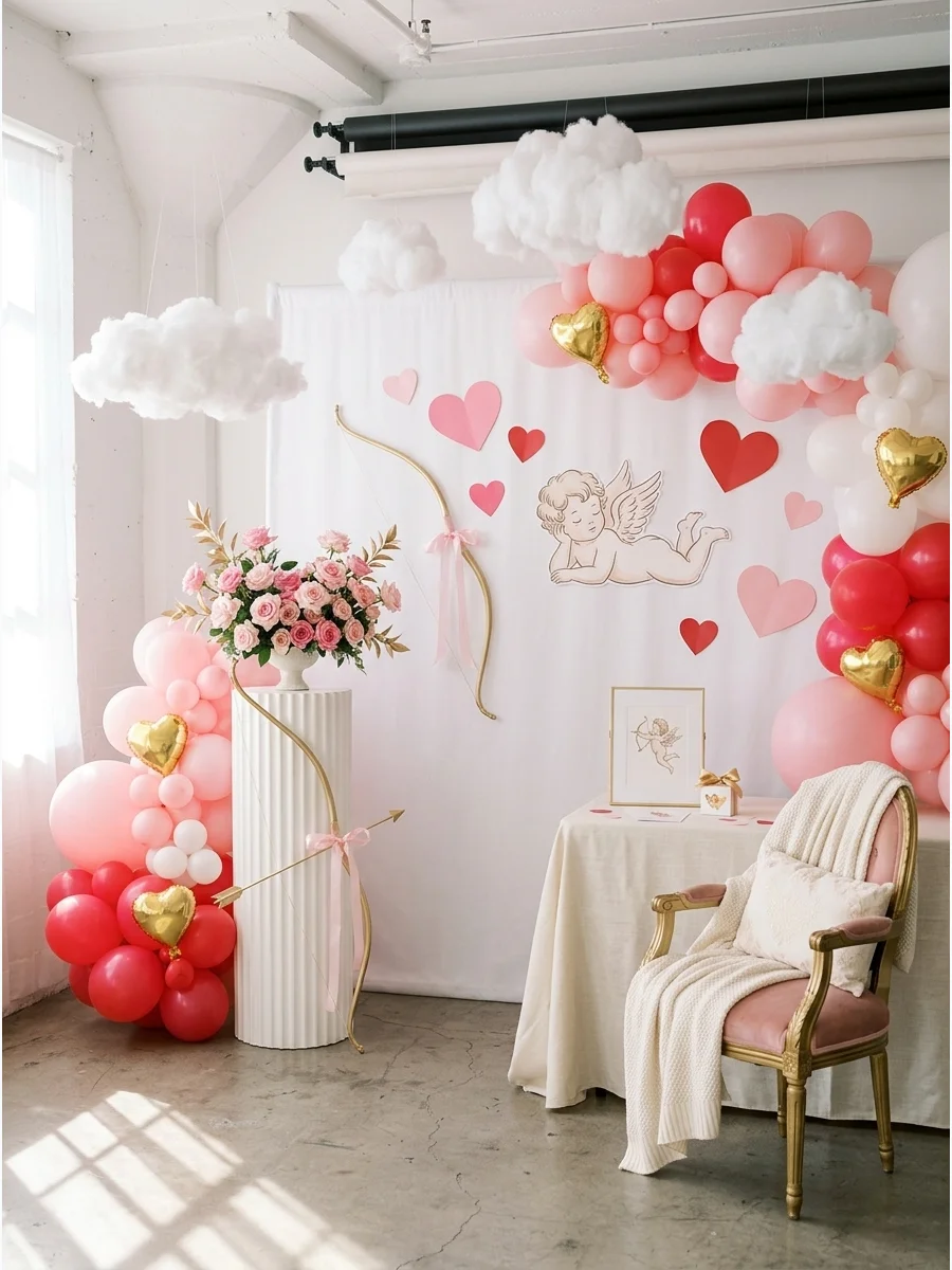 Gold bow and arrow prop with pink roses in a white studio.