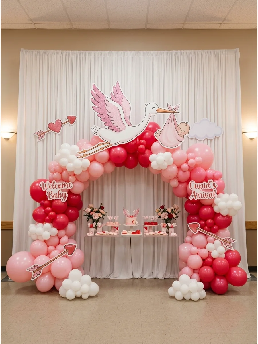 Large stork cutout with pink wings against white drapes.
