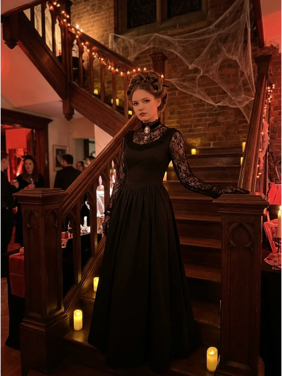 Woman in a black Victorian vampire gown with lace sleeves on a staircase.