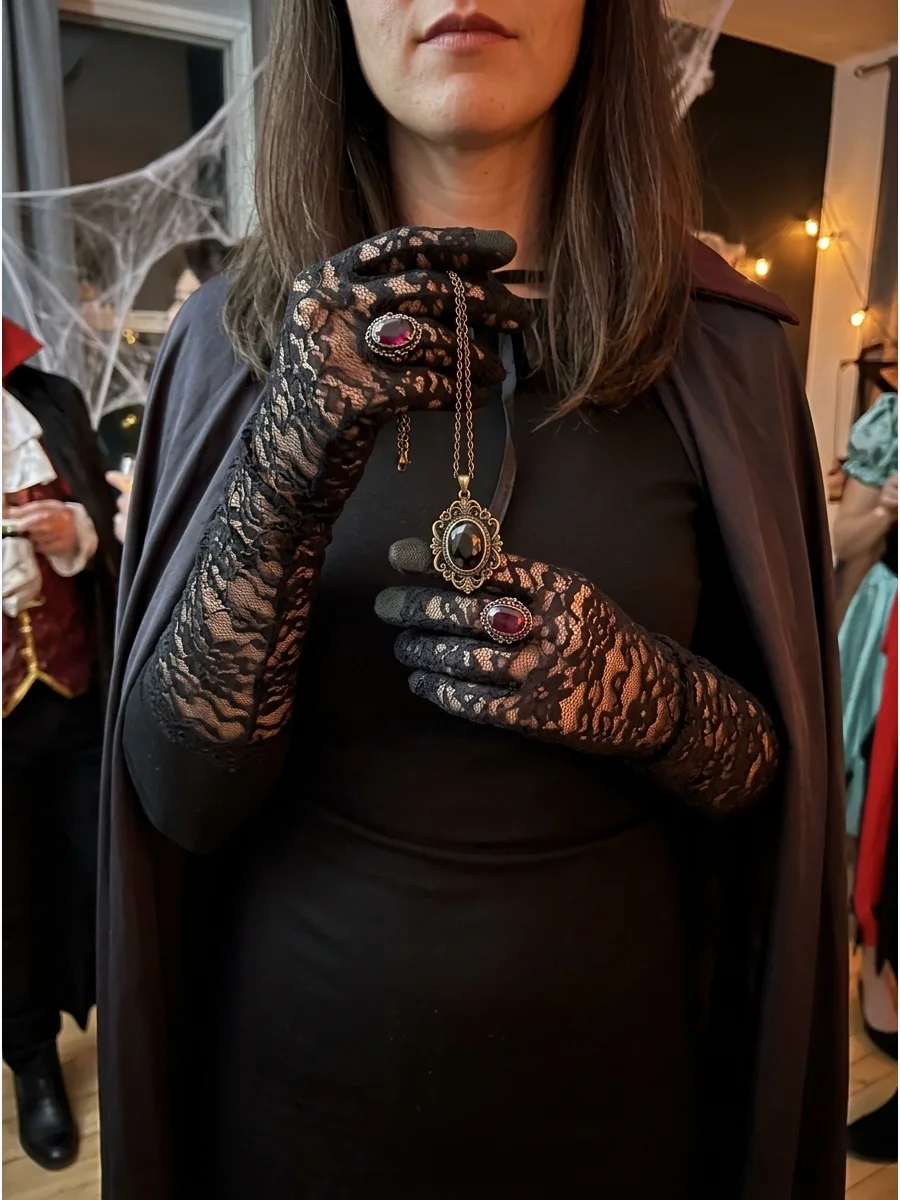 Lace gloves and vintage jewelry for a vampire costume.
