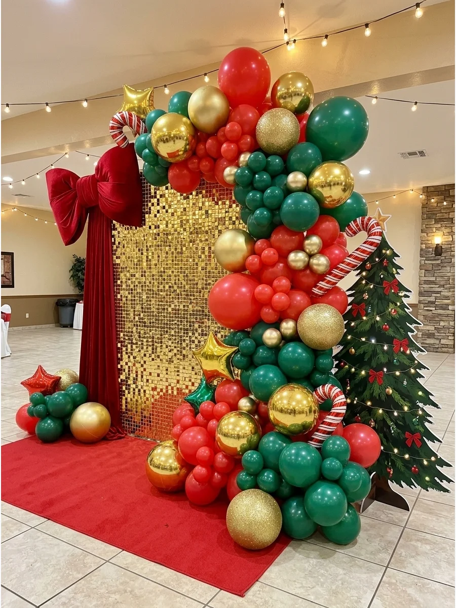 A holiday balloon garland featuring oversized gold ornament props.