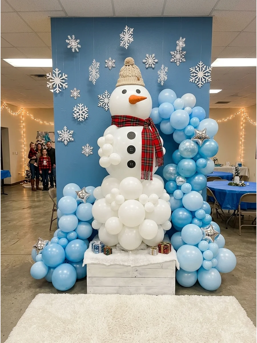 A white balloon snowman with a black hat and red scarf in a community center.
