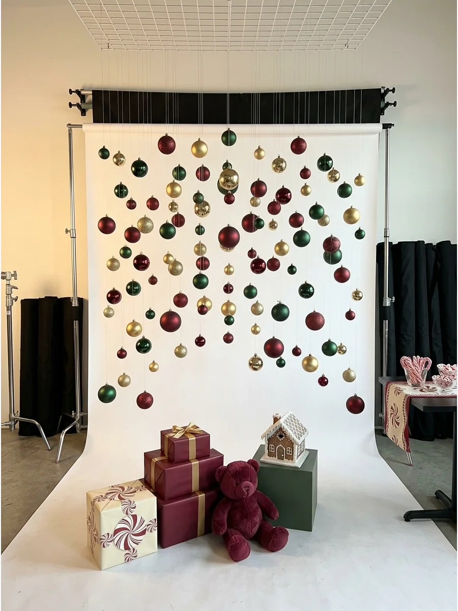 Red and white ornaments hanging on clear lines to create a floating backdrop.