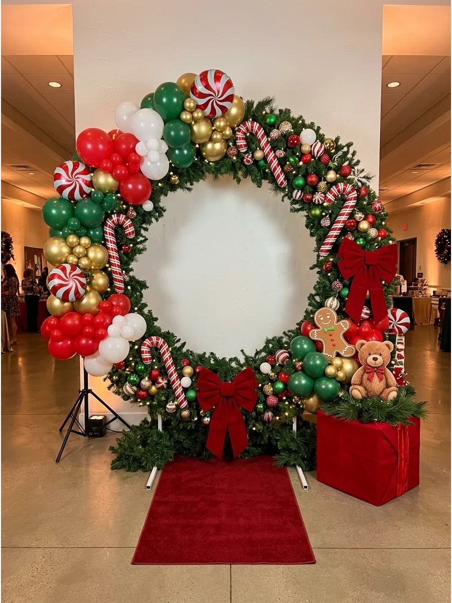 A giant green Christmas wreath used as a structural photo backdrop.