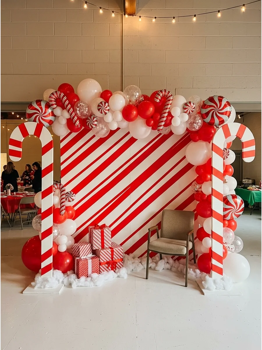 A whimsical red and white striped backdrop with candy cane props.