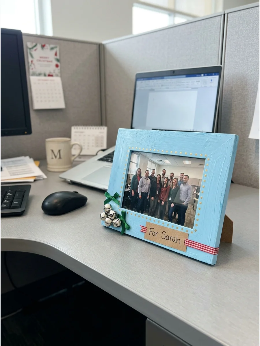 Decorated blue picture frame on an office desk.
