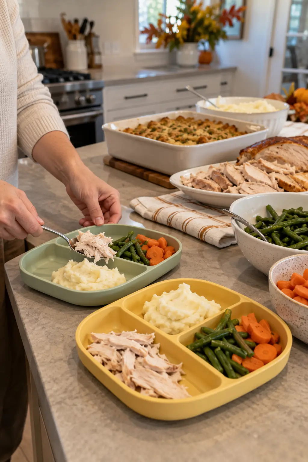 Adult hands assembling small Thanksgiving dinner trays for children at a buffet