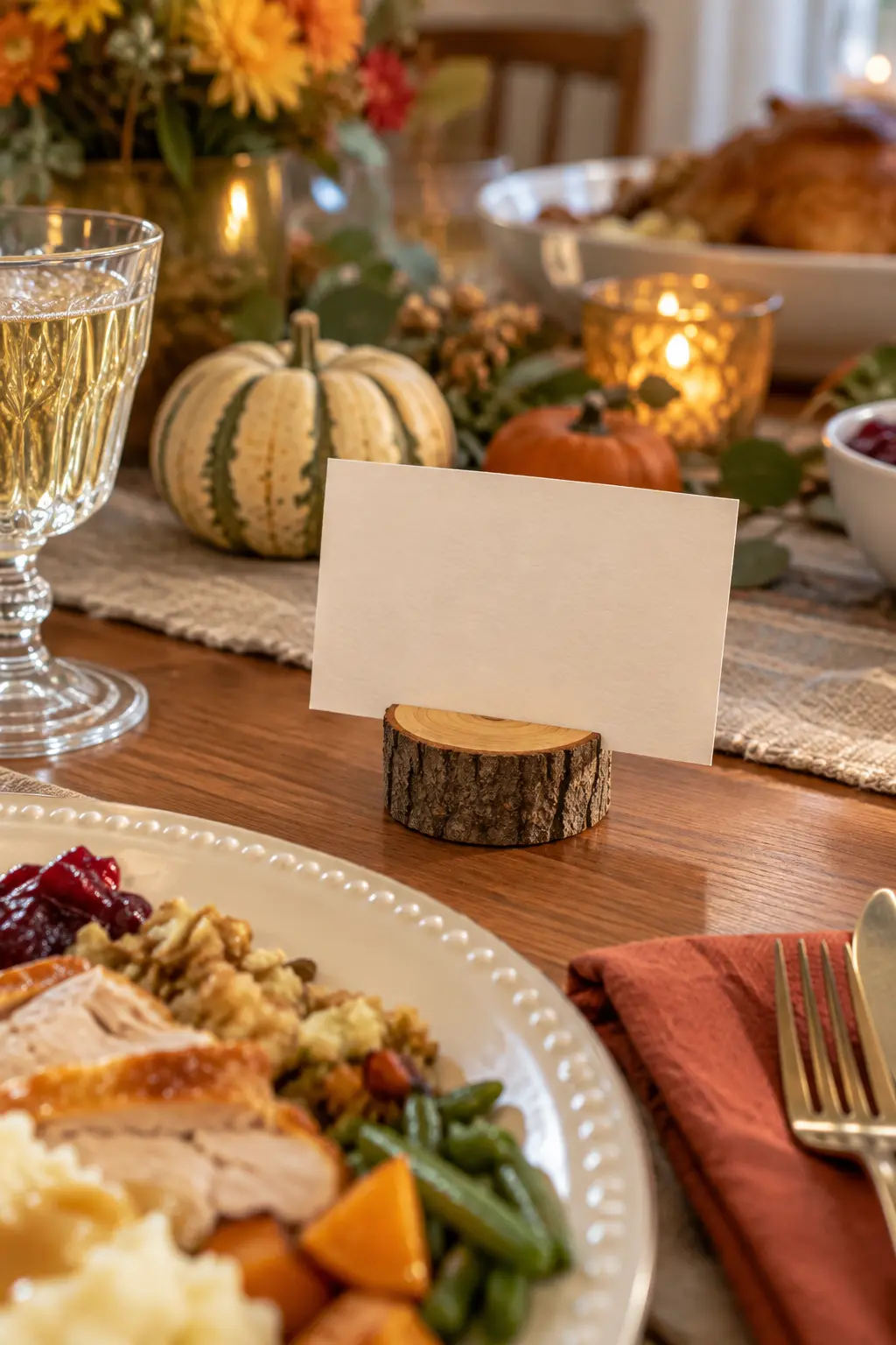 Tiny wood recipe card holder displaying a blank card near a Thanksgiving plate